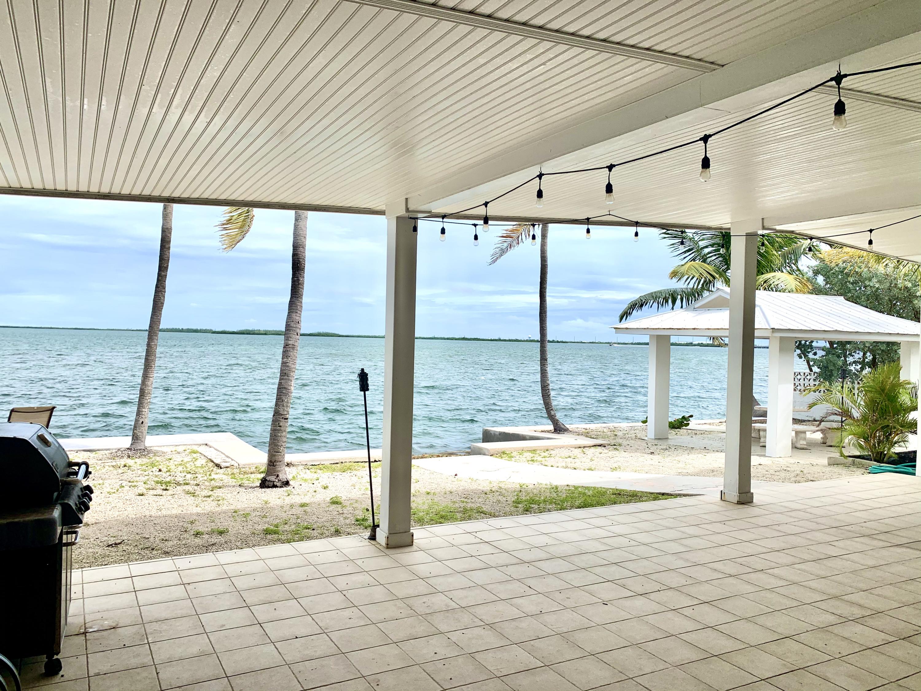 2 Allamanda Terrace Key West, FL 33040 - Photo 27 of 29 a view of an empty room with a floor to ceiling window and pool table