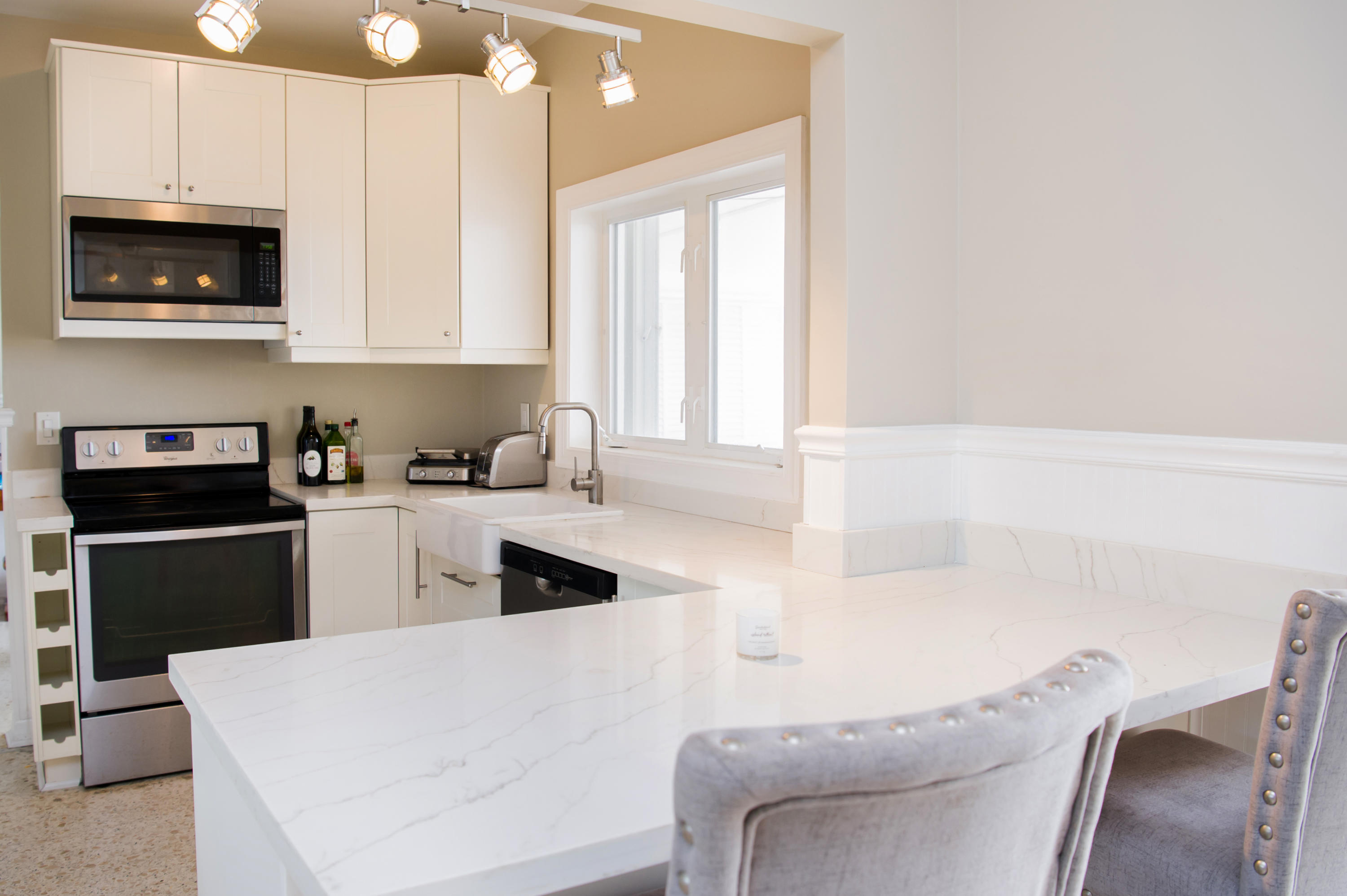 2 Allamanda Terrace Key West, FL 33040 - Photo 9 of 29 a kitchen with stainless steel appliances a stove a sink a microwave a refrigerator and cabinets