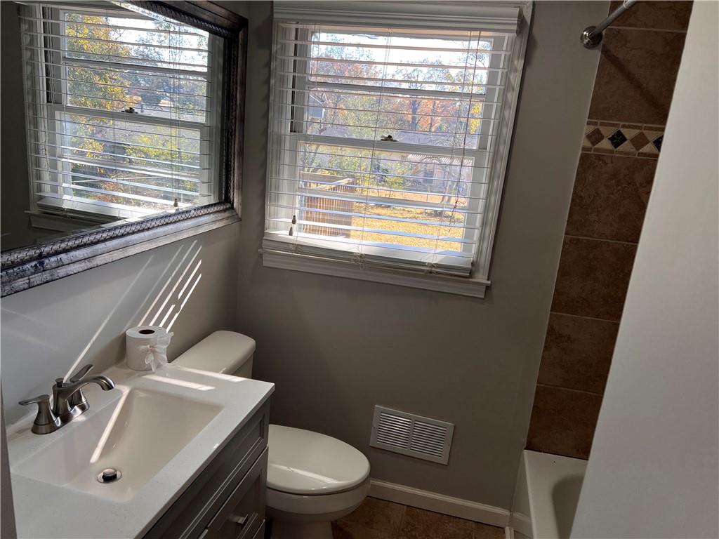 2047 Panstone Court Southwest Marietta, GA 30060 - Photo 14 of 18 a bathroom with a sink a toilet and a mirror