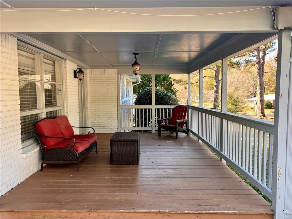 2047 Panstone Court Southwest Marietta, GA 30060 - Photo 2 of 18 a living room with furniture floor to ceiling window and wooden floor