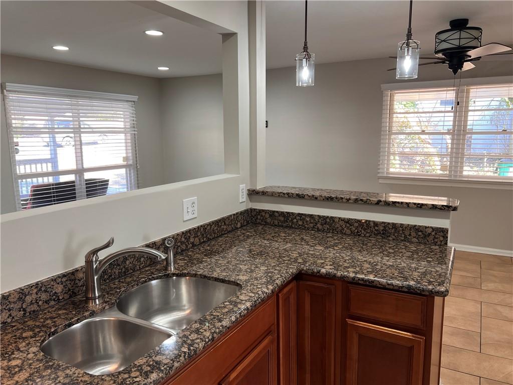 2047 Panstone Court Southwest Marietta, GA 30060 - Photo 6 of 18 a kitchen with granite countertop a sink and a window