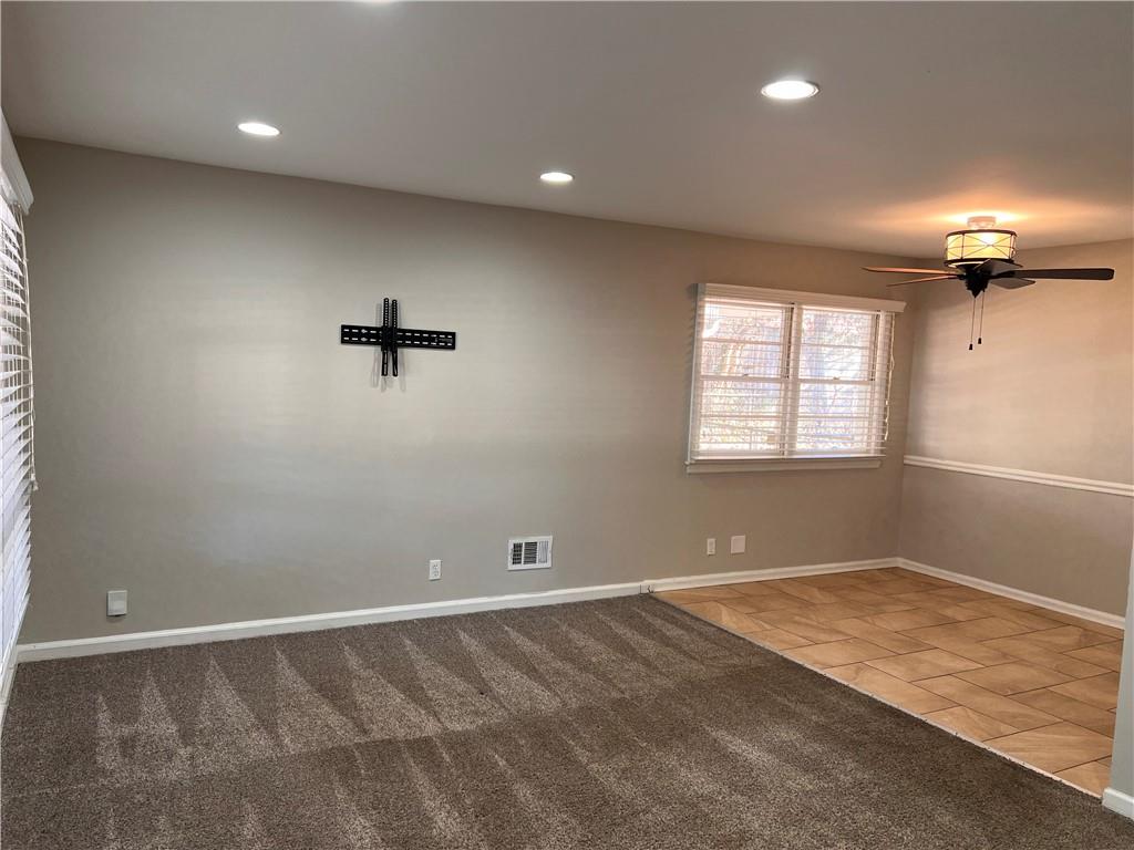 2047 Panstone Court Southwest Marietta, GA 30060 - Photo 7 of 18 an empty room with a window and a ceiling fan