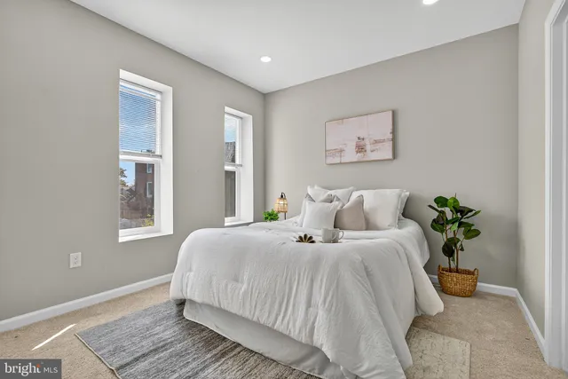 a bedroom with bed and a window