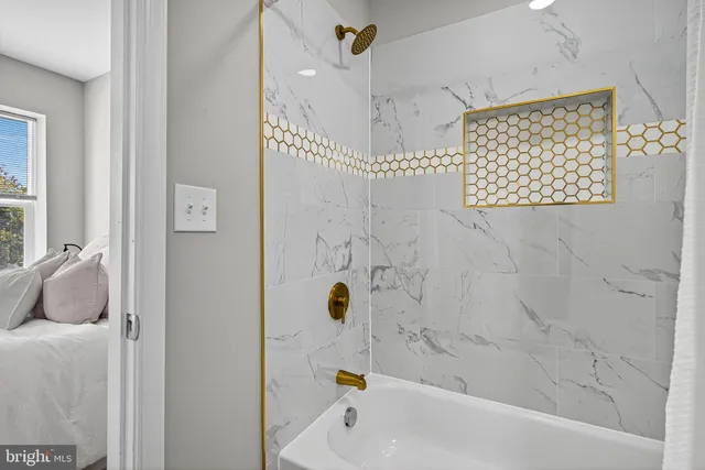 a bathroom with a tub and a shower