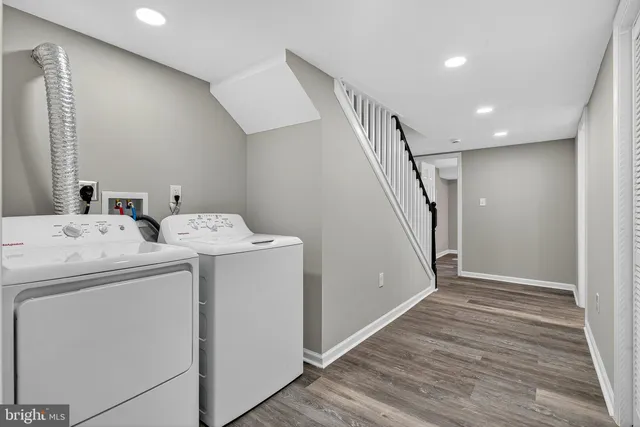 a view of storage and utility room with washer and dryer