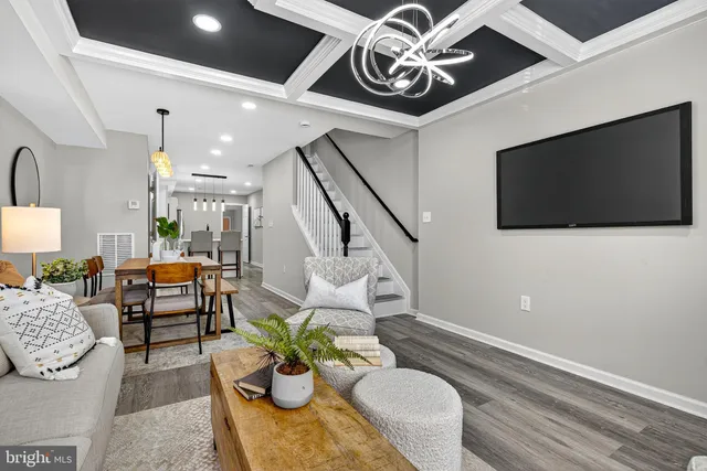 a living room with furniture and flat screen tv