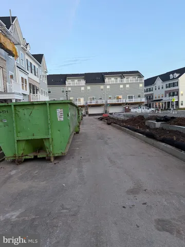 a view of kitchen with white cabinets