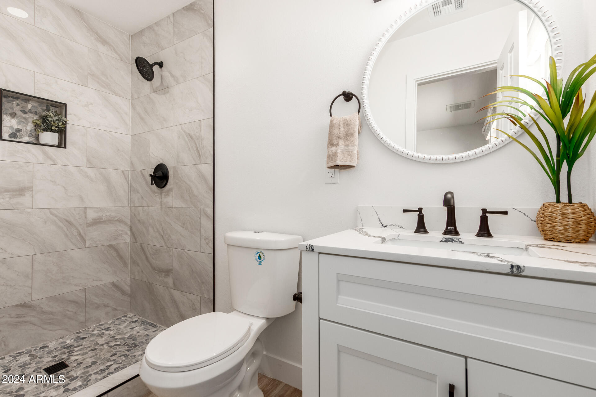 3822 West Ocotillo Road Phoenix, AZ 85019 - Photo 54 of 59 a bathroom with a granite countertop sink mirror vanity and toilet
