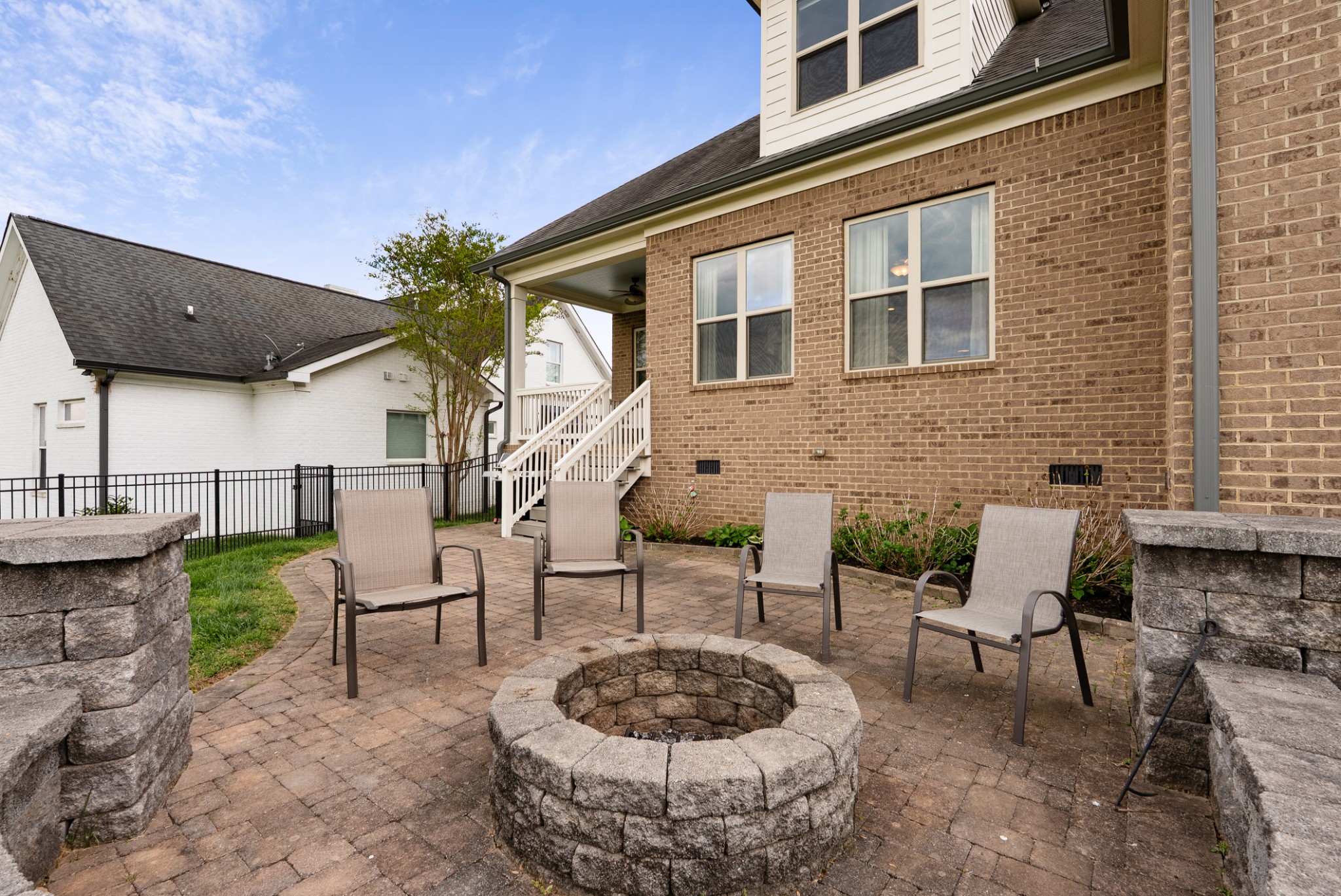 148 Truman Road West Franklin, TN 37064 - Photo 34 of 42 a view of a patio with table and chairs potted plants and a bench
