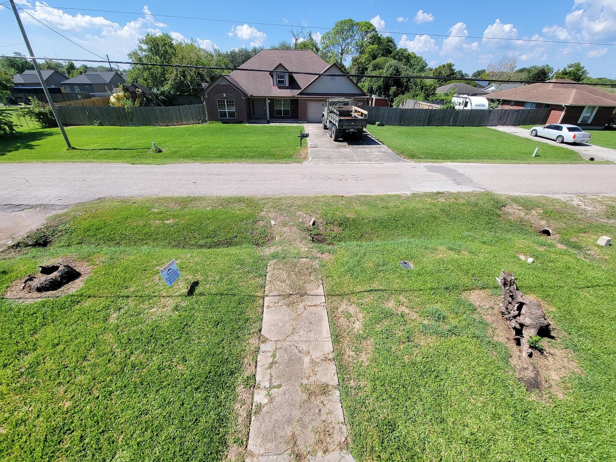 711 Ave A, Unit 4 La Marque, TX 77568 - Photo 20 of 21 a view of a backyard with a garden and plants