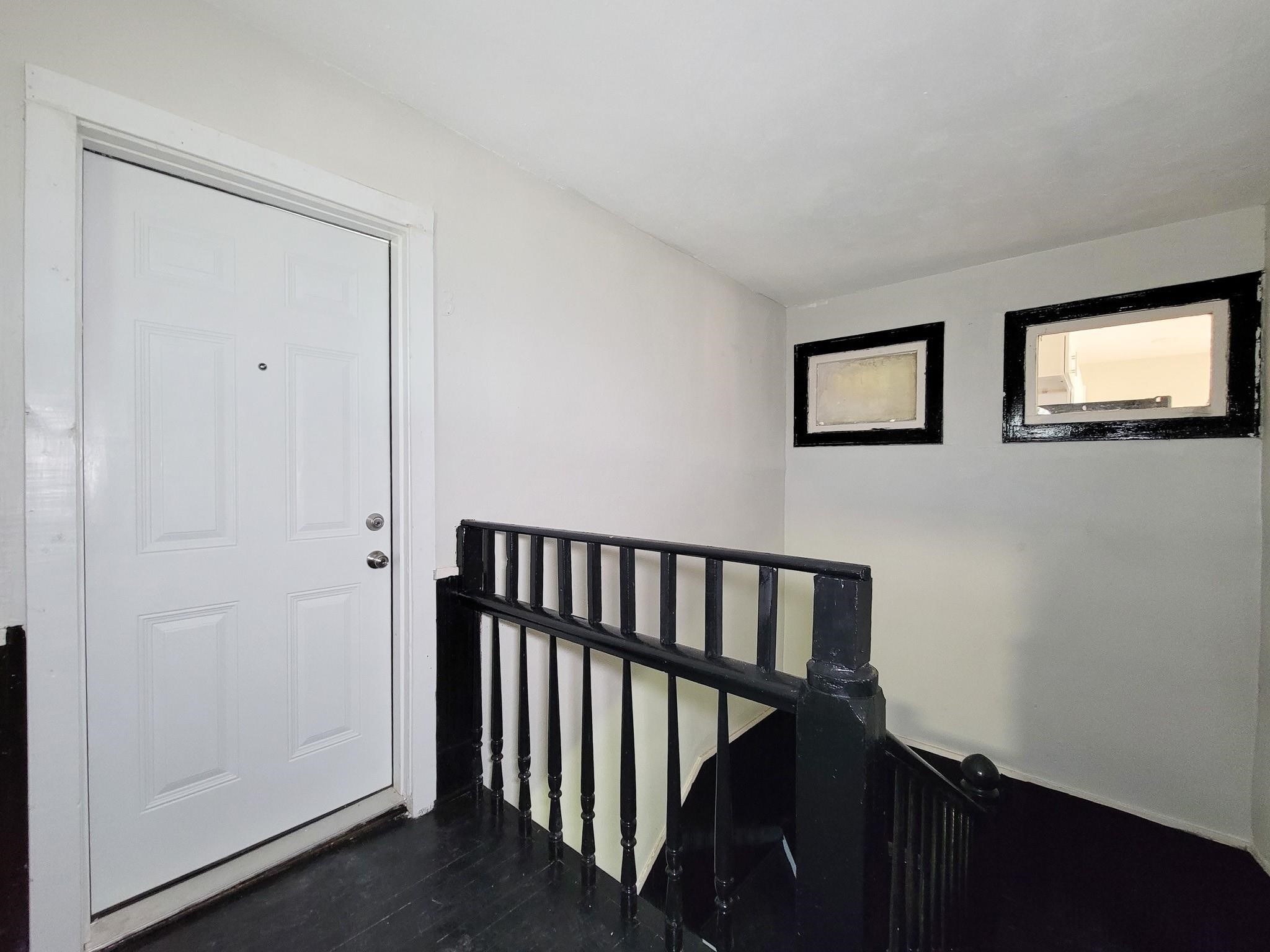 711 Ave A, Unit 4 La Marque, TX 77568 - Photo 3 of 21 a view of hallway with stairs