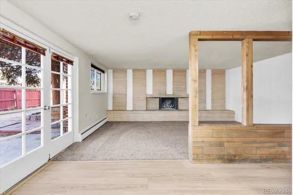 a view of living room with furniture and window