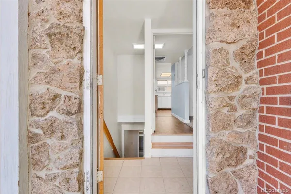 walk in closet with a bathroom