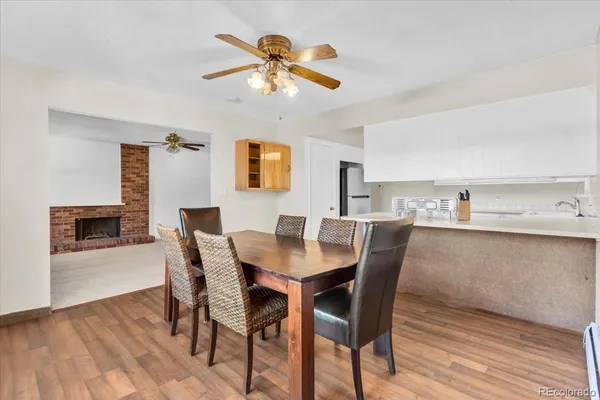 a view of a dining room with furniture and wooden floor