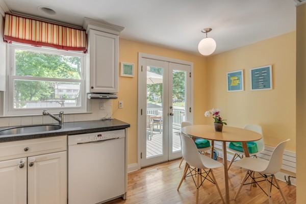 100 Mayflower Road Needham, MA 02492 - Photo 14 of 28 a kitchen with stainless steel appliances granite countertop a sink and a window