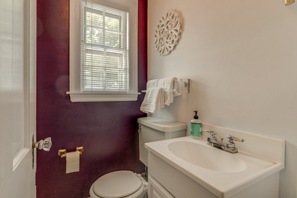 100 Mayflower Road Needham, MA 02492 - Photo 17 of 28 a bathroom with a sink mirror and toilet