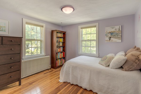 100 Mayflower Road Needham, MA 02492 - Photo 18 of 28 a bedroom with a bed and a window
