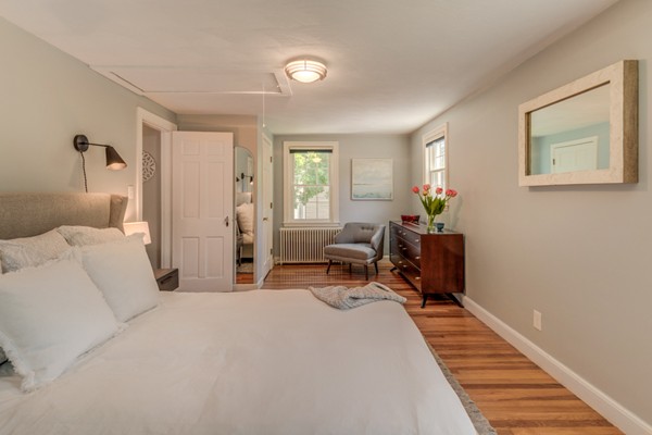 100 Mayflower Road Needham, MA 02492 - Photo 22 of 28 a bedroom with furniture and a wooden floor