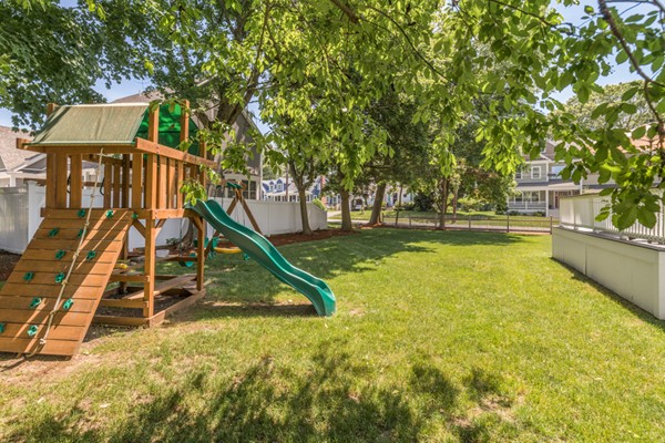 100 Mayflower Road Needham, MA 02492 - Photo 25 of 28 a view of a swimming pool with a park