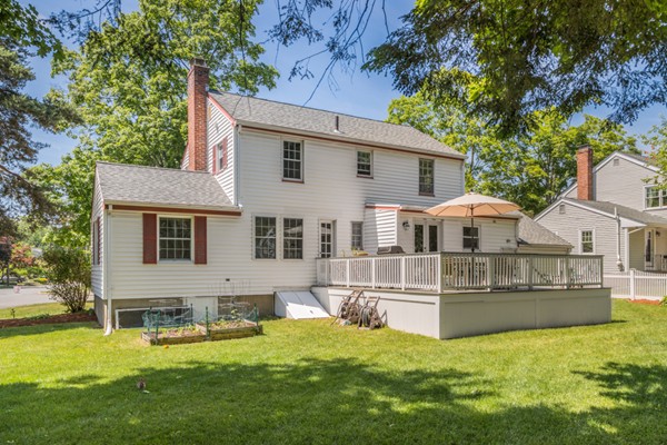 100 Mayflower Road Needham, MA 02492 - Photo 26 of 28 a view of a house with a patio and a yard with a large tree