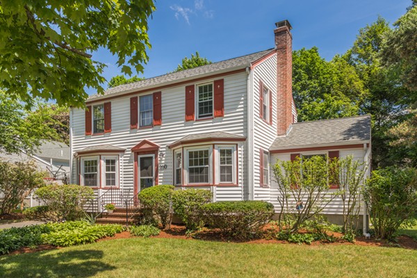 100 Mayflower Road Needham, MA 02492 - Photo 3 of 28 a front view of a house with garden