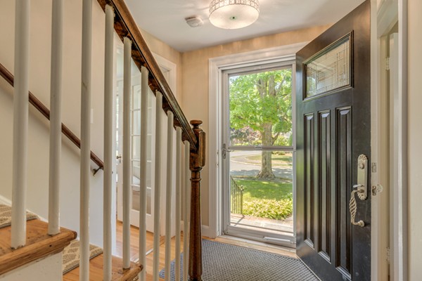 100 Mayflower Road Needham, MA 02492 - Photo 4 of 28 a view of an entryway with wooden floor and door