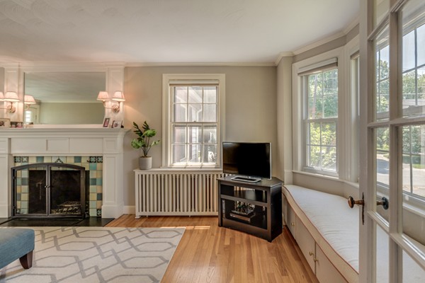100 Mayflower Road Needham, MA 02492 - Photo 5 of 28 a view of livingroom with workspace and a fireplace