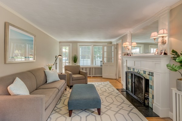 100 Mayflower Road Needham, MA 02492 - Photo 6 of 28 a living room with furniture and a fireplace