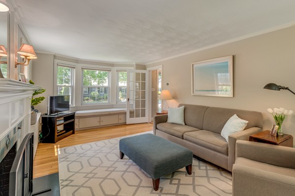 100 Mayflower Road Needham, MA 02492 - Photo 7 of 28 a living room with furniture and a fireplace