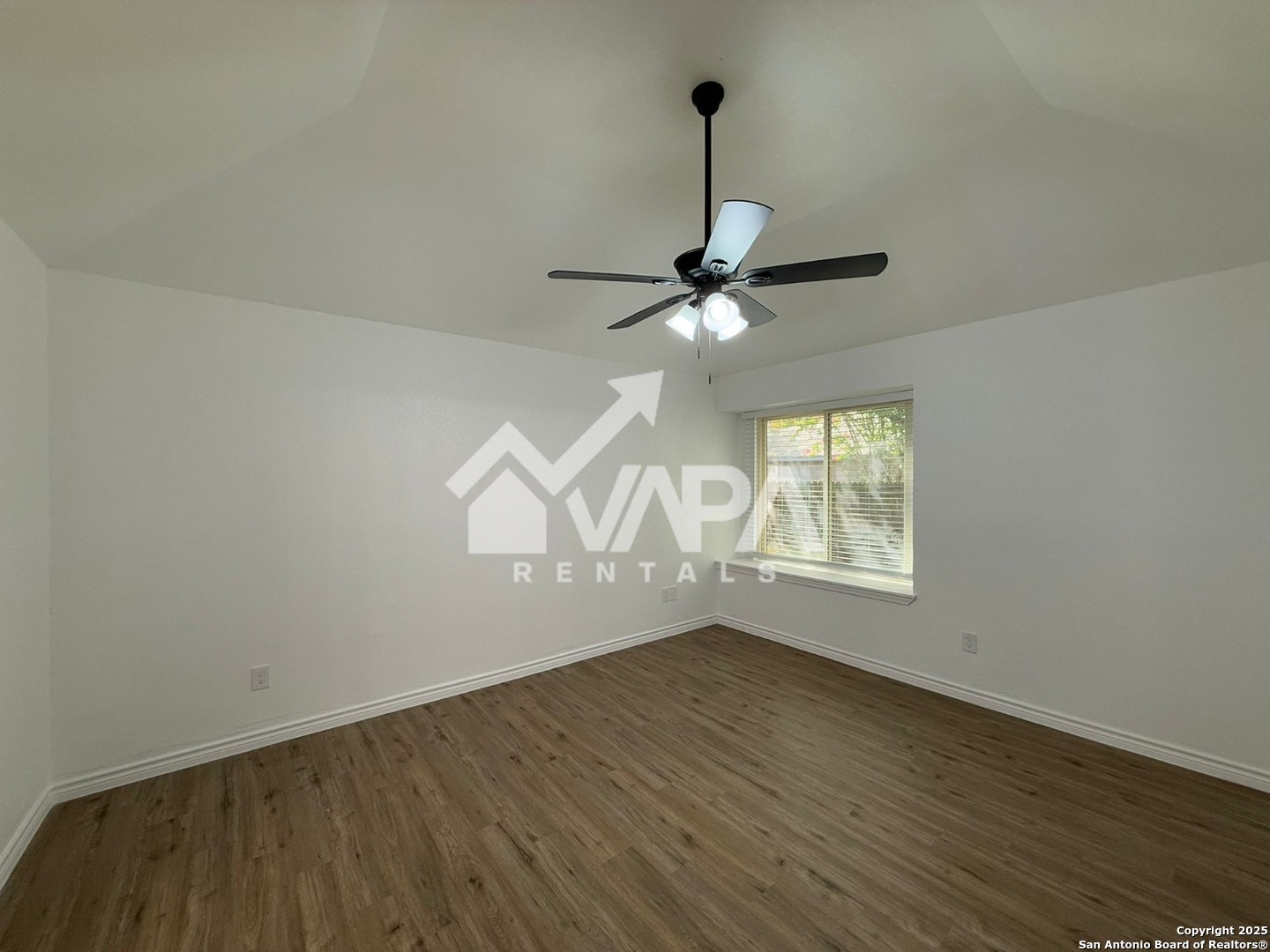 6406 Gray Ridge San Antonio, TX 78233 - Photo 12 of 15 wooden floor in an empty room with a window
