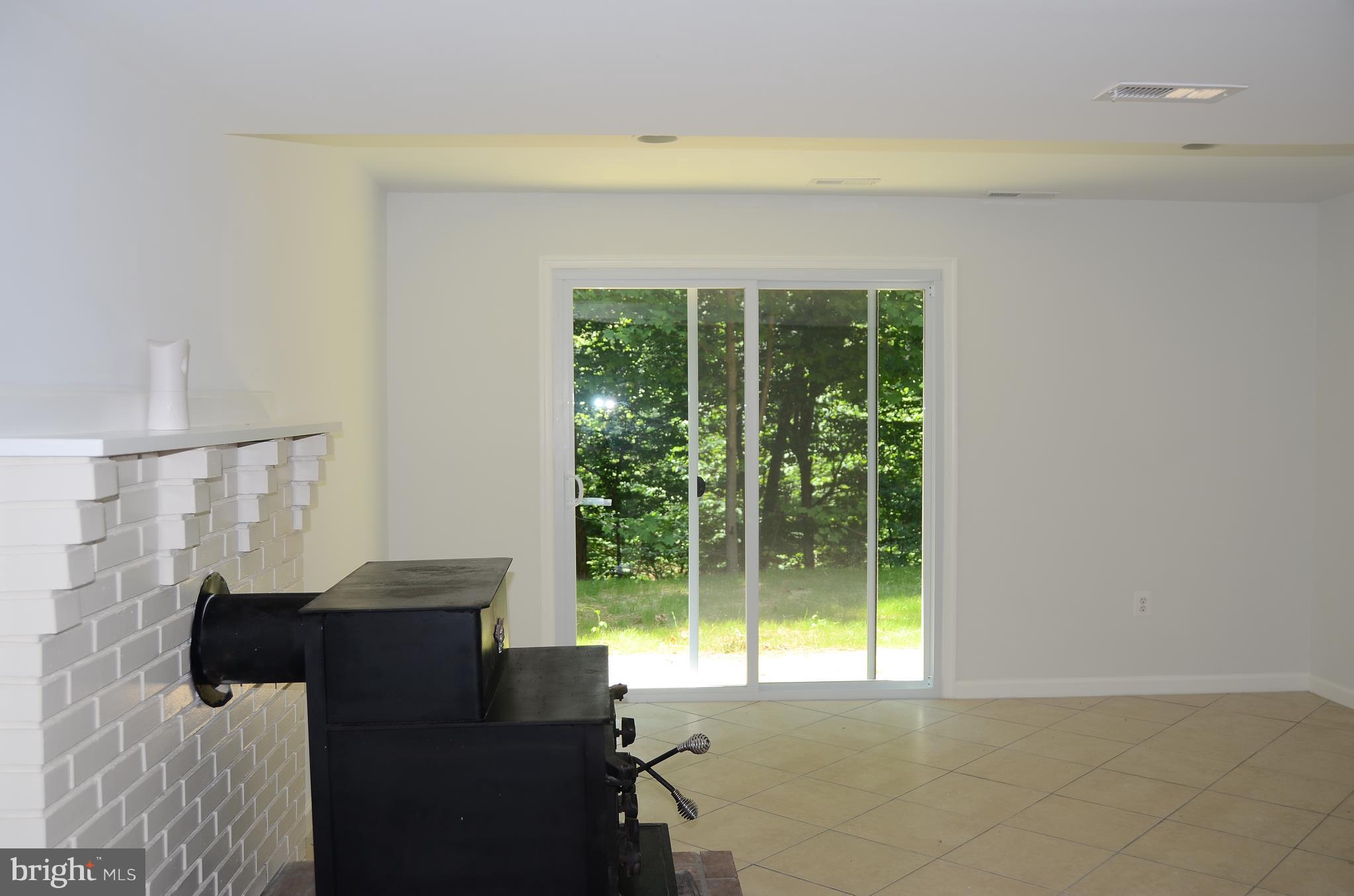 4750 Hardesty Road Huntingtown, MD 20639 - Photo 19 of 26 a living room with furniture and a large window