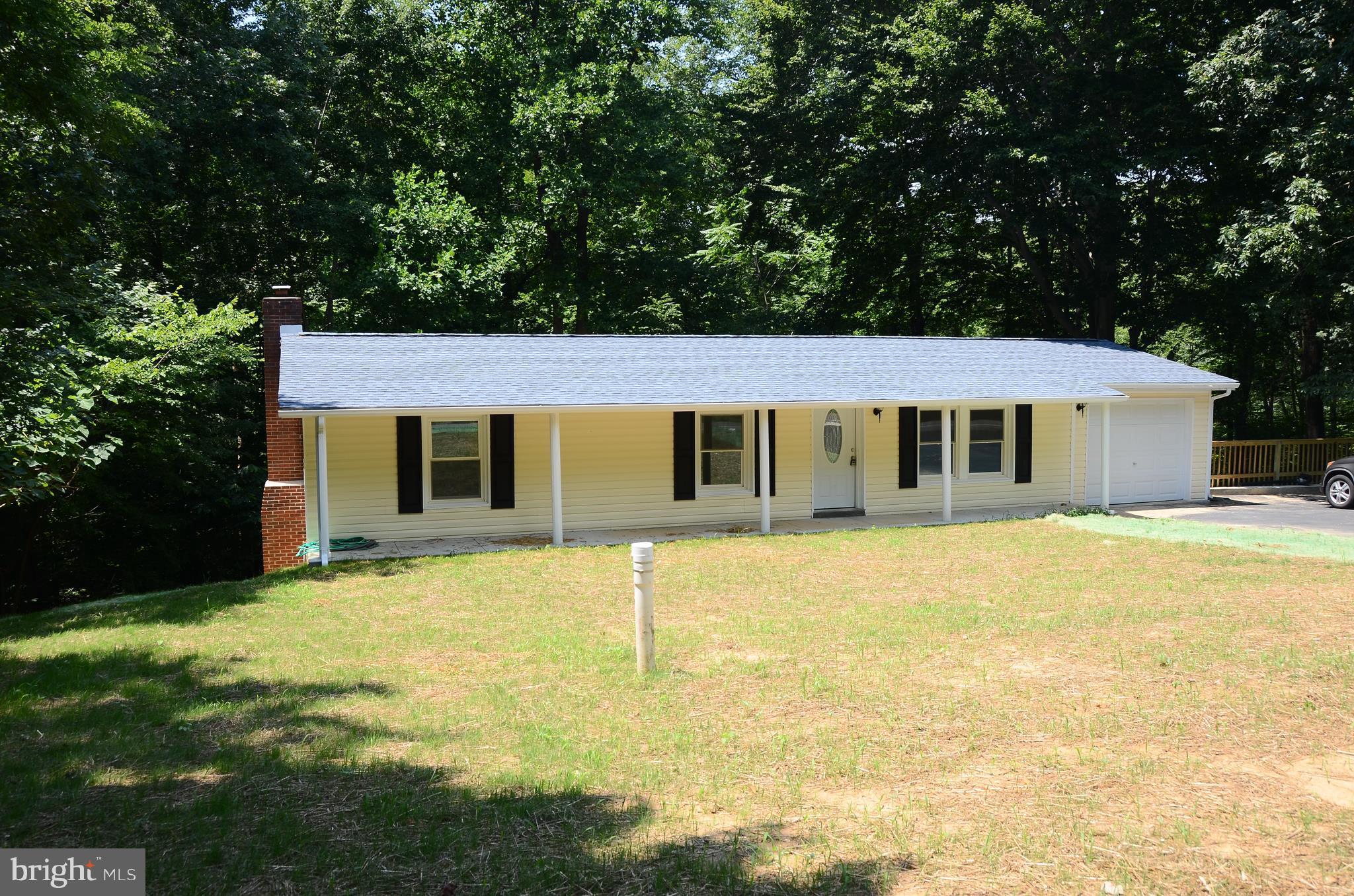 4750 Hardesty Road Huntingtown, MD 20639 - Photo 3 of 26 a front view of a house with a big yard