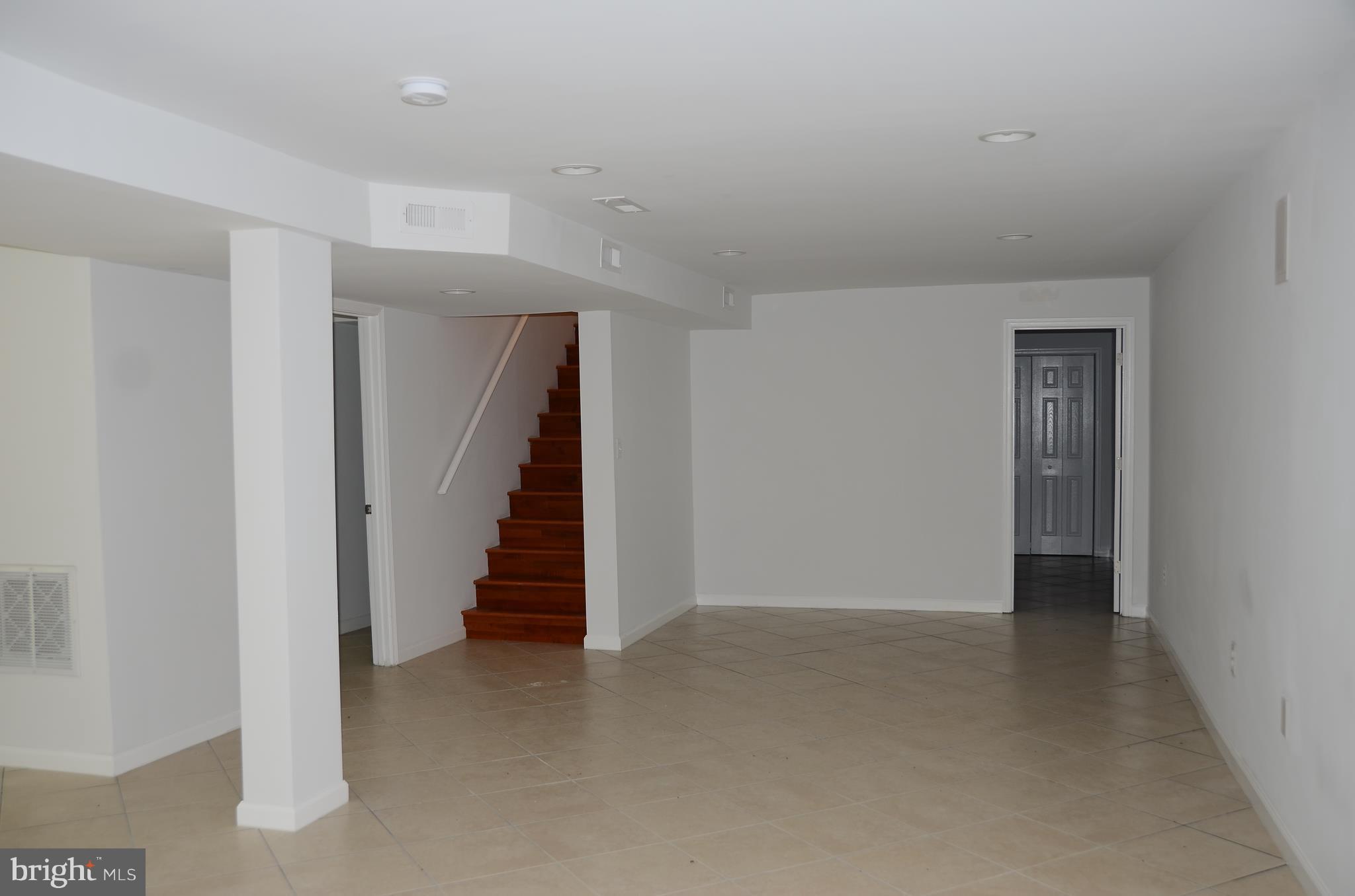 4750 Hardesty Road Huntingtown, MD 20639 - Photo 21 of 26 a view of an empty room with stairs