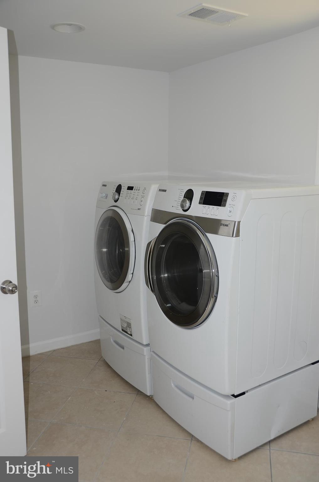 4750 Hardesty Road Huntingtown, MD 20639 - Photo 22 of 26 a utility room with dryer and washer