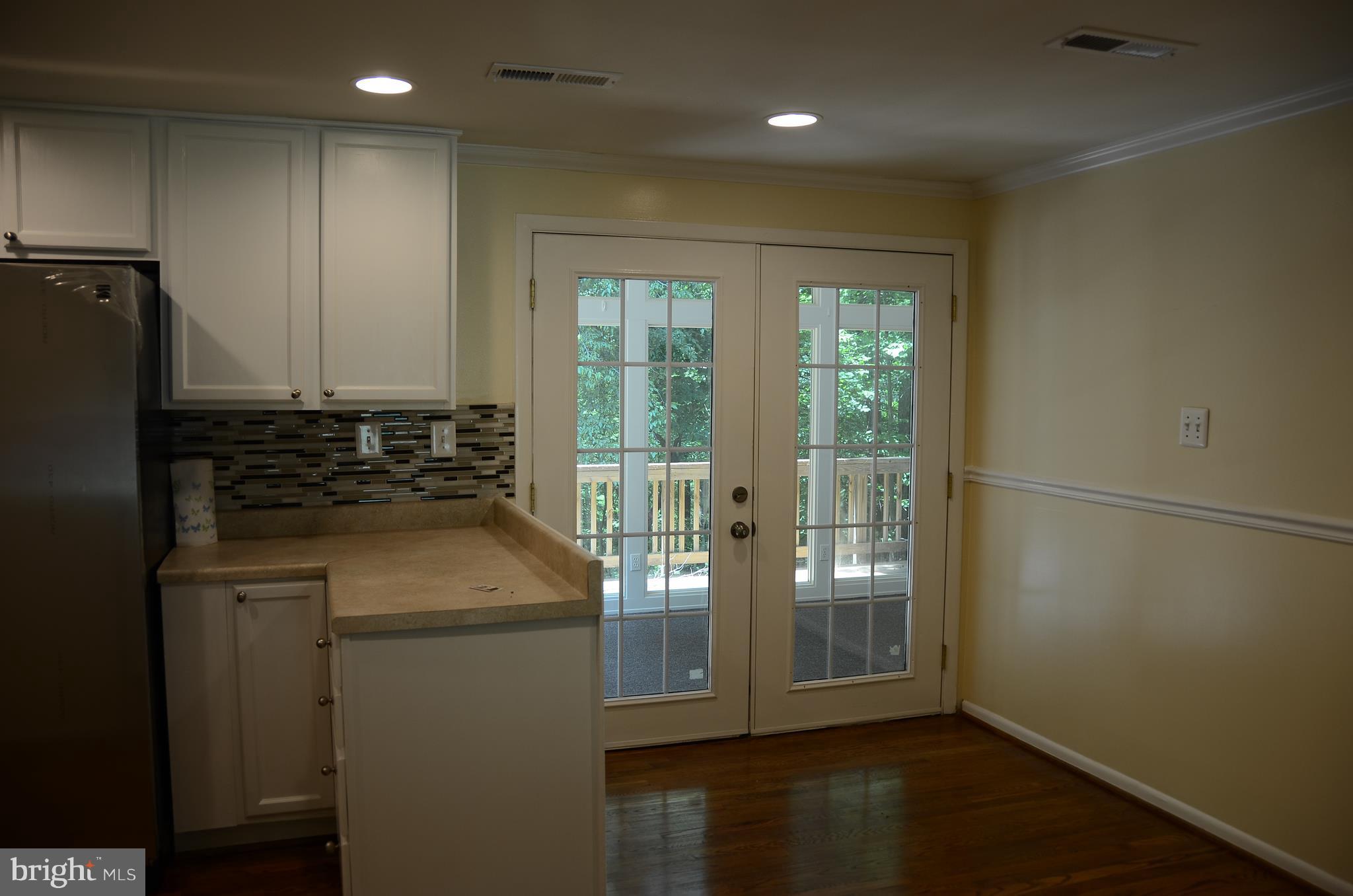 4750 Hardesty Road Huntingtown, MD 20639 - Photo 6 of 26 a kitchen with kitchen island a counter top space appliances and a window
