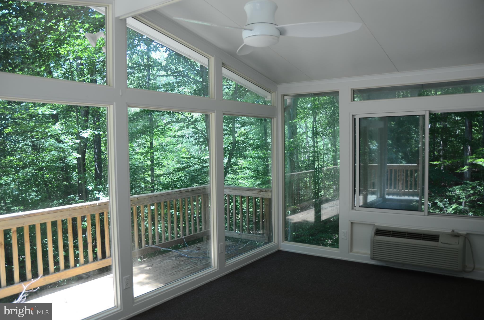 4750 Hardesty Road Huntingtown, MD 20639 - Photo 7 of 26 a view of a room with porch and wooden floor