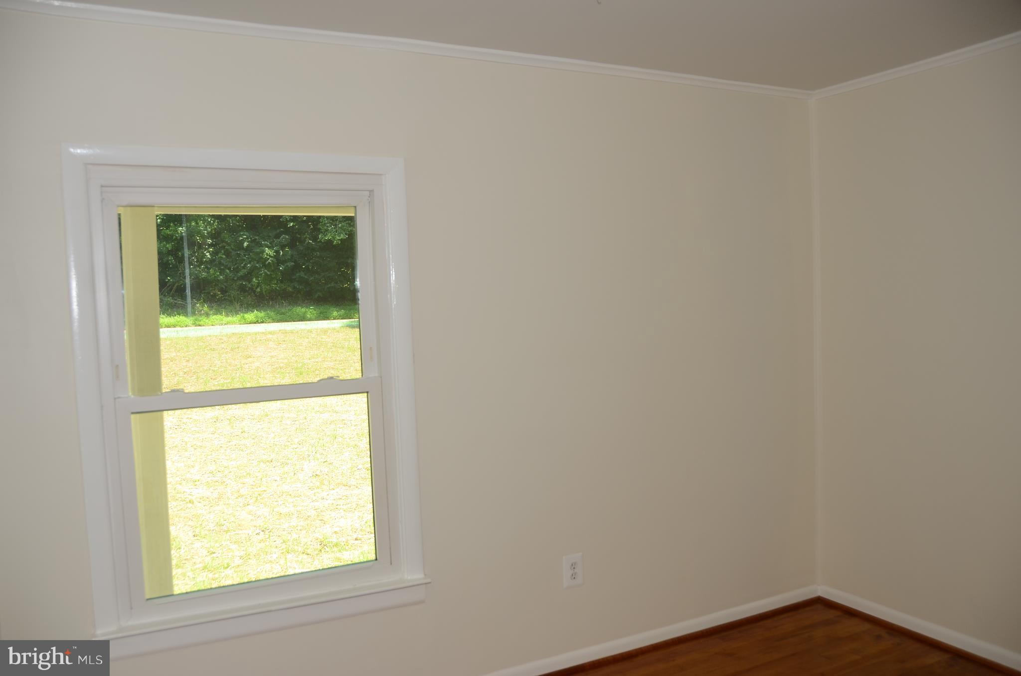 4750 Hardesty Road Huntingtown, MD 20639 - Photo 10 of 26 a view of an empty room with a window