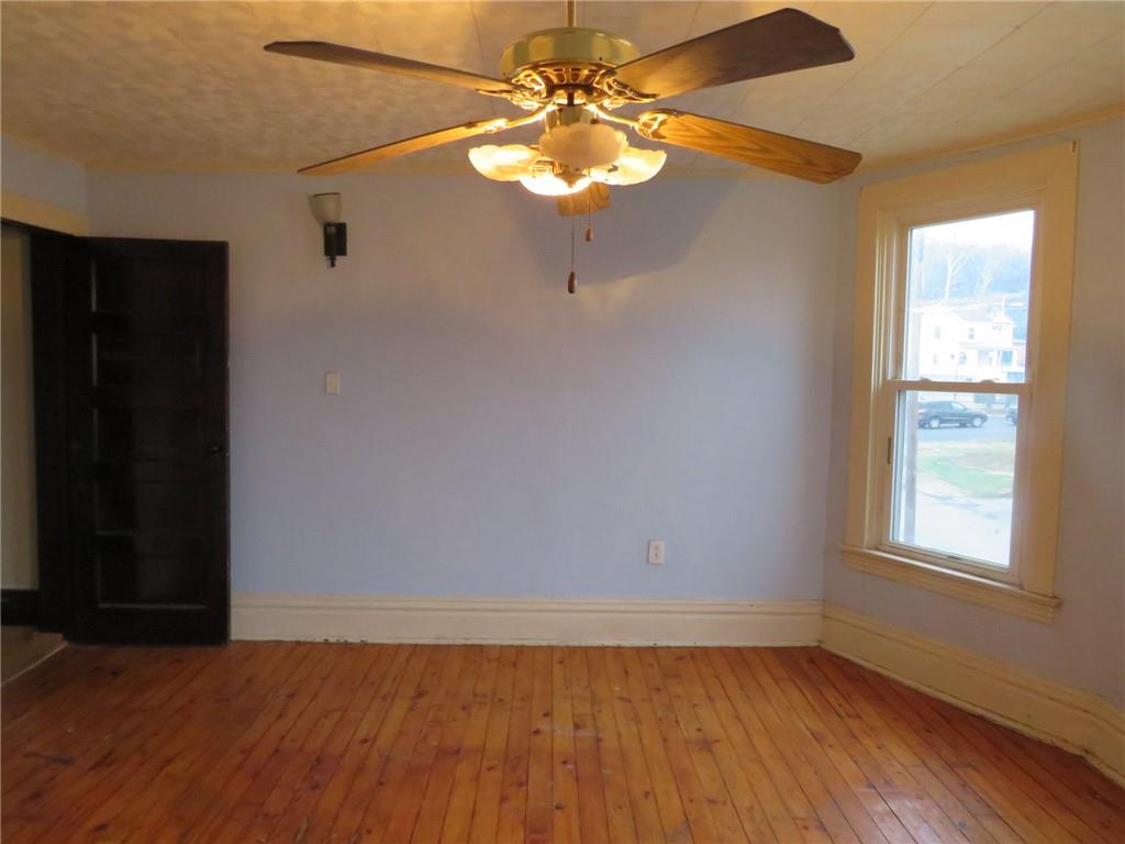 1203 2nd Avenue Conway, PA 15027 - Photo 17 of 43 wooden floor in an empty room with a window