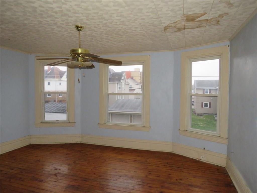 1203 2nd Avenue Conway, PA 15027 - Photo 22 of 43 a view of empty room with window and wooden floor