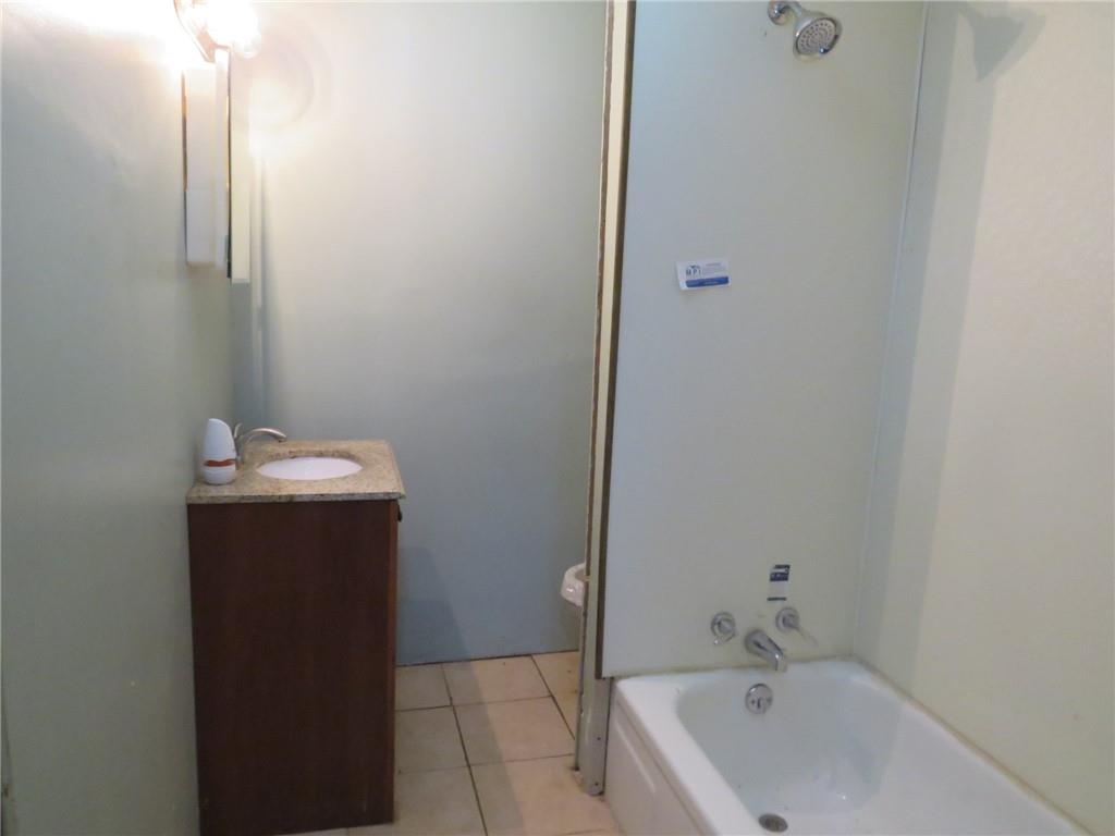 1203 2nd Avenue Conway, PA 15027 - Photo 23 of 43 a bathroom with a sink and mirror