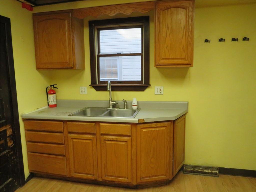 1203 2nd Avenue Conway, PA 15027 - Photo 28 of 43 a bathroom with a sink and a mirror