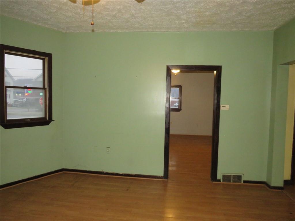 1203 2nd Avenue Conway, PA 15027 - Photo 31 of 43 an empty room with wooden floor closet and windows