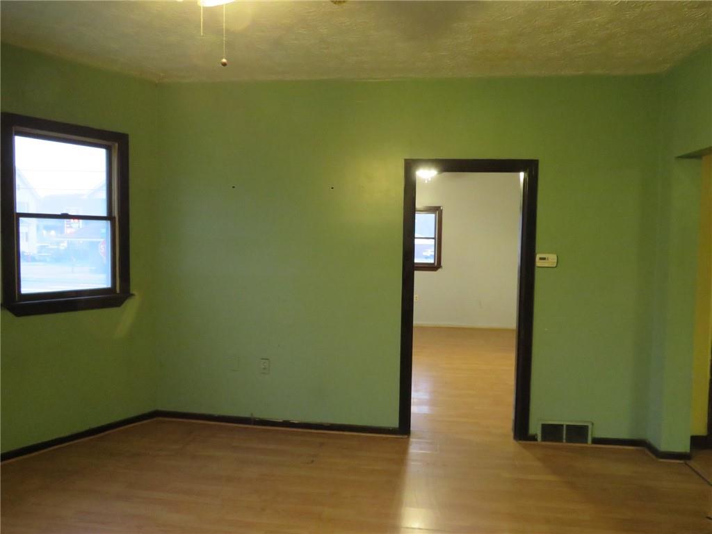 1203 2nd Avenue Conway, PA 15027 - Photo 32 of 43 an empty room with wooden floor and windows