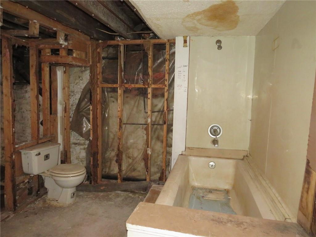 1203 2nd Avenue Conway, PA 15027 - Photo 40 of 43 a bathroom with a toilet and shower