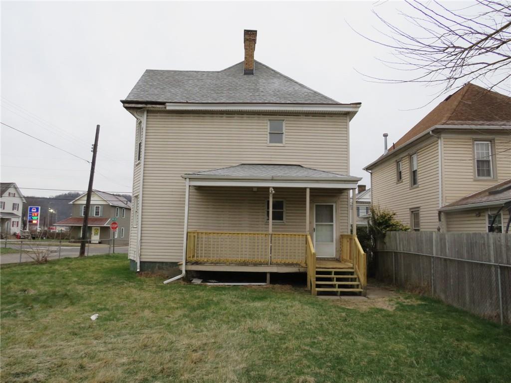 1203 2nd Avenue Conway, PA 15027 - Photo 42 of 43 a front view of a house with a garden