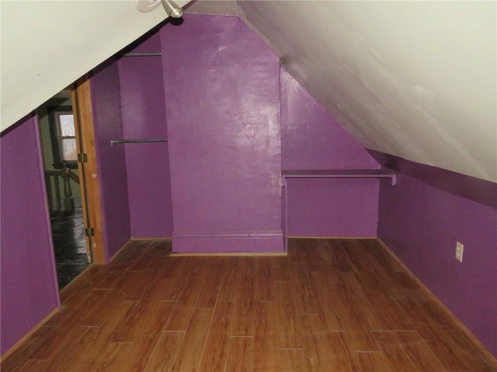 1203 2nd Avenue Conway, PA 15027 - Photo 5 of 43 a view of a small space with wooden floor and a staircase