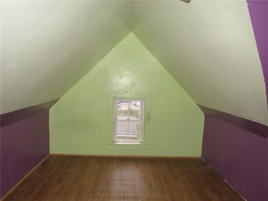 1203 2nd Avenue Conway, PA 15027 - Photo 6 of 43 a view of an empty room with wooden floor and a window