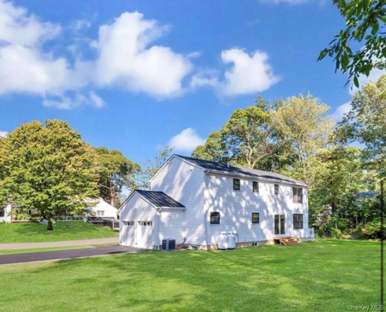 34 Huyler Road East Setauket, NY 11733 - Photo 11 of 11 a view of a house with a yard