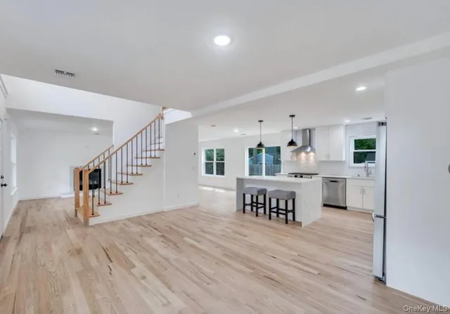 a view of kitchen with furniture and wooden floor