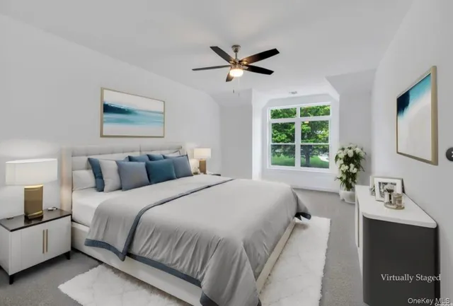 a bedroom with bed and window